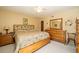 Spacious bedroom featuring a ceiling fan, a comfortable bed, and matching furniture at 7078 Lexington Cir, Brooksville, FL 34602