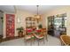 Dining room showcases a glass table, stylish chairs, and access to a screened lanai at 7078 Lexington Cir, Brooksville, FL 34602