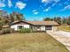 Charming single-story home with a well-manicured lawn and an attached two-car garage at 7078 Lexington Cir, Brooksville, FL 34602