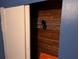 View of a closet with wooden paneling and white wire shelving, offering practical storage space in the home at 8428 Paxton Dr, Port Richey, FL 34668