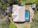 Aerial view of home and screened pool, plus detached shed at 1001 Bayvista Dr, Tarpon Springs, FL 34689