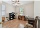 Cozy bedroom with wood flooring and natural light at 1001 Bayvista Dr, Tarpon Springs, FL 34689