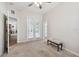 Bedroom with private access to the yard, carpet floors, and a ceiling fan at 1001 Bayvista Dr, Tarpon Springs, FL 34689