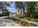 Landscaped front yard of a beautiful home with shade trees at 1001 Bayvista Dr, Tarpon Springs, FL 34689