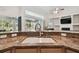 Granite countertops and stainless faucet highlight the kitchen's luxurious design at 1001 Bayvista Dr, Tarpon Springs, FL 34689