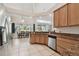 Spacious kitchen with stainless steel appliances, granite countertops, and tile floors at 1001 Bayvista Dr, Tarpon Springs, FL 34689