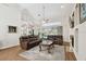 Bright living room open to the kitchen and pool area at 1001 Bayvista Dr, Tarpon Springs, FL 34689