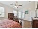 Comfortable main bedroom with large windows and a ceiling fan for optimal comfort at 1001 Bayvista Dr, Tarpon Springs, FL 34689