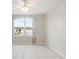 Bright, airy bedroom with a large window and neutral tile flooring at 11248 Andy Dr, Riverview, FL 33569