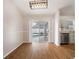 Bright dining room with wood floors, modern light fixture, and sliding glass doors to the pool at 11248 Andy Dr, Riverview, FL 33569