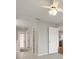 Hallway with neutral walls, tile flooring and ceiling fan at 11248 Andy Dr, Riverview, FL 33569