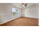 Vaulted ceiling living room with wood floors, large window, and bright ambiance at 11248 Andy Dr, Riverview, FL 33569