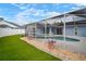 A screened-in pool area offers privacy and relaxation, featuring a beautiful blue pool at 11248 Andy Dr, Riverview, FL 33569