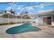 Screened-in pool area with a kidney-shaped pool and access to backyard at 11248 Andy Dr, Riverview, FL 33569