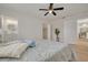 Cozy bedroom with a ceiling fan, an open closet, and a door to the kitchen at 121 Shirley Dr, Largo, FL 33770