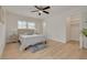 Bedroom with a ceiling fan, an open closet, and ample natural light at 121 Shirley Dr, Largo, FL 33770