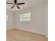 Clean, bright, and unfurnished bedroom with hardwood floors and ample natural light at 121 Shirley Dr, Largo, FL 33770