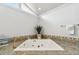 Bathroom featuring a large bathtub with beautiful tile accents and bright lighting at 12769 Foresman Blvd, Port Charlotte, FL 33981