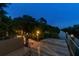 Beautiful waterfront dock with a seating area and decorative lighting for evening enjoyment at 12769 Foresman Blvd, Port Charlotte, FL 33981