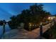 Beautiful waterfront dock with a seating area and decorative lighting for evening enjoyment at 12769 Foresman Blvd, Port Charlotte, FL 33981