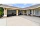 Beige home exterior featuring a two-car garage and a concrete driveway at 12769 Foresman Blvd, Port Charlotte, FL 33981
