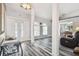 Welcoming foyer with stylish wood floors, decorative glass doors, and natural light at 12769 Foresman Blvd, Port Charlotte, FL 33981