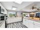 This open kitchen features stainless steel appliances, granite countertops, and an open floor plan at 12769 Foresman Blvd, Port Charlotte, FL 33981