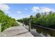 Picturesque waterfront view from a private dock surrounded by lush greenery at 12769 Foresman Blvd, Port Charlotte, FL 33981