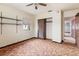 Bedroom with a ceiling fan, carpeted flooring, a window, and closet at 12845 95Th N St, Largo, FL 33773