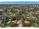 Bird's eye view of a well-maintained community surrounded by mature trees and tropical landscaping at 140 Miramar Ne Blvd, St Petersburg, FL 33704