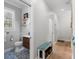 Stylish half bathroom with blue patterned tile floors, wooden vanity, and shiplap accent wall at 140 Miramar Ne Blvd, St Petersburg, FL 33704