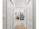 Hallway view of a spa bathroom featuring walk in shower, vanity, and tiled flooring at 140 Miramar Ne Blvd, St Petersburg, FL 33704