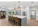 Gourmet kitchen featuring a large island, stainless steel appliances, and breakfast bar at 140 Miramar Ne Blvd, St Petersburg, FL 33704