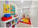 Bright and colorful playroom with storage, a play table, and ' artwork at 140 Miramar Ne Blvd, St Petersburg, FL 33704