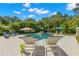 Relaxing pool area with lounge chairs and umbrellas, perfect for enjoying sunny days at 140 Miramar Ne Blvd, St Petersburg, FL 33704