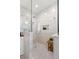 Spa-like marble shower with glass enclosure, built-in niche, rainfall showerhead, and a teak shower bench at 140 Miramar Ne Blvd, St Petersburg, FL 33704