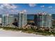 Aerial view of the condominium community with beach access and pools at 1540 Gulf Blvd # Ph7, Clearwater Beach, FL 33767