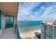 Tiled balcony view highlighting beautiful ocean scenery and adjacent high-rise building at 1540 Gulf Blvd # Ph7, Clearwater Beach, FL 33767