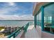 Private balcony with views of the bay with turquoise railing and tiled deck at 1540 Gulf Blvd # Ph7, Clearwater Beach, FL 33767