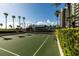 Outdoor basketball court alongside tropical trees and a high rise tower at 1540 Gulf Blvd # Ph7, Clearwater Beach, FL 33767