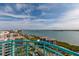 Expansive water view from a condo balcony, with a blue railing, overlooking scenic coastline at 1540 Gulf Blvd # Ph7, Clearwater Beach, FL 33767