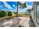 Backyard wooden deck offers a great view of the homes and lush landscaping at 185 New England Ave # 33, Palm Harbor, FL 34684