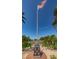 Community Landmark with a monument honoring veterans beneath a waving American flag at 185 New England Ave # 33, Palm Harbor, FL 34684