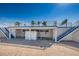 Pool area featuring stairs, palm trees, and building with no diving sign at 185 New England Ave # 33, Palm Harbor, FL 34684