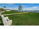 Relax on the waterfront park with benches, lush lawn, and views of the dock and marina at 185 New England Ave # 33, Palm Harbor, FL 34684