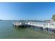 Dock with lounge furniture perfect for relaxing and enjoying the coastal scenery at 1868 Shore S Dr # 602, South Pasadena, FL 33707