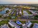 An aerial view of the condos and community amenities which include a swimming pool and ponds at this complex at 204 Mary Dr, Oldsmar, FL 34677