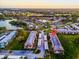 Aerial view of the community showcasing the lake, landscaping, and building layout at 204 Mary Dr, Oldsmar, FL 34677