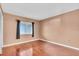 Bright bedroom featuring hardwood floors, neutral walls and closet at 204 Mary Dr, Oldsmar, FL 34677