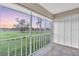 Relaxing screened patio with a view of the backyard and lush greenery at 204 Mary Dr, Oldsmar, FL 34677